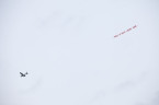 Divya Mehra, Your Turn Next (You've Got the Juice Now), 2011. Off-site aerial advertising, red nylon sailcloth, 60 x 1080 cm